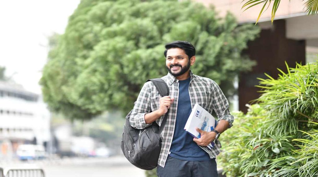 BBA Student With a bag smiling 